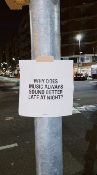 a sign on a pole that says why does music always sound better late at night?