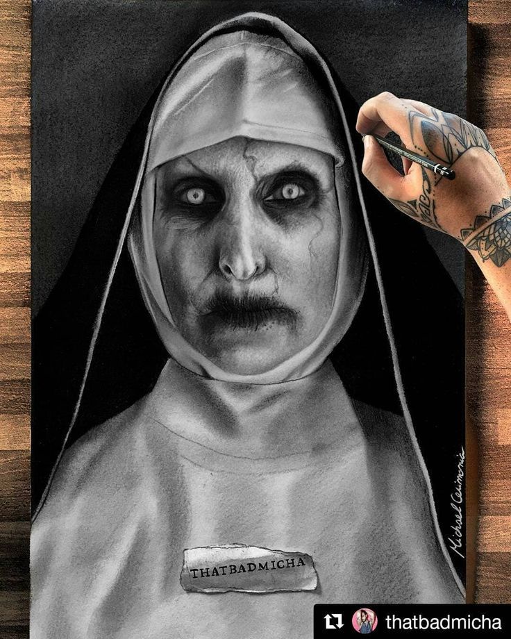 a drawing of a nun holding a pen