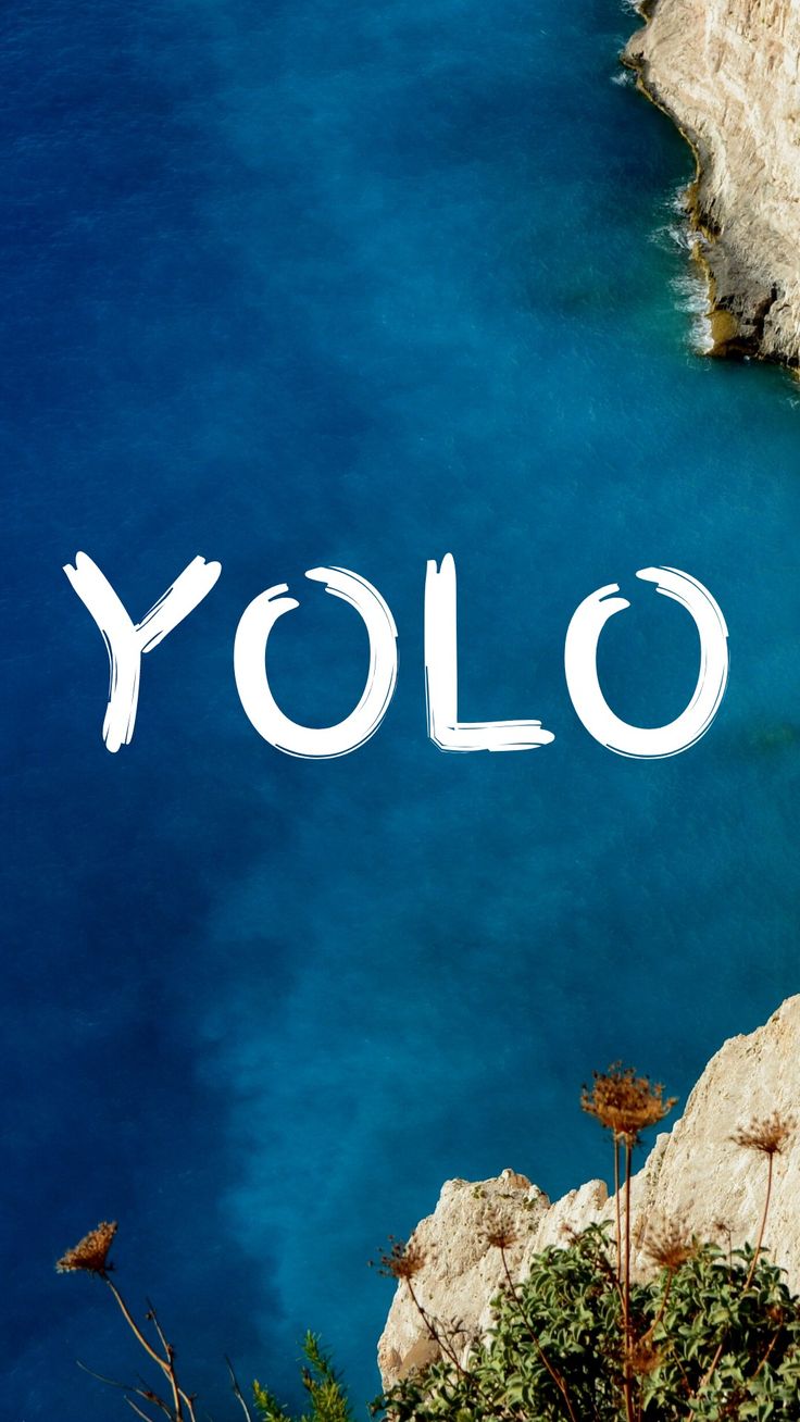 the word yolo written in white over blue water