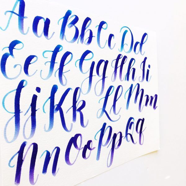 the upper and lower letters are painted with watercolor on white paper, while the lower letters have blue ink