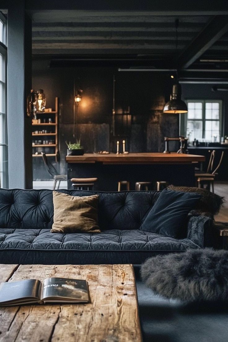 a living room with couches, tables and chairs next to windows in the background