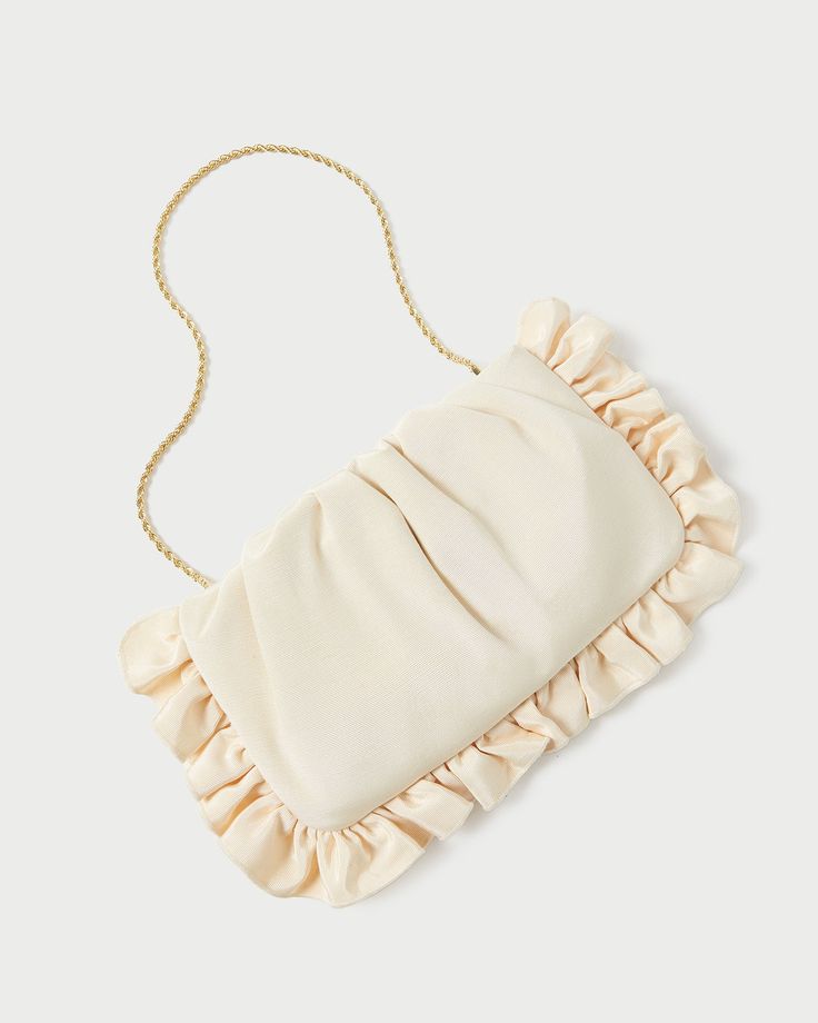 Clutch in vanilla moiré with ruffle detailing. Features a removable twisted gold chain strap, frame closure, and interior card slot. Feminine Gold Evening Clutch, Elegant Spring Evening Bag With Chain Strap, Beige Evening Bag With Chain Strap For Formal Occasions, Spring Formal Clutch With Chain Strap, Chic Cream Evening Bag, Chic Cream Evening Bag For Events, Chic Cream Evening Bag For Formal Occasions, Elegant Evening Bag With Gold Chain, Spring Evening Clutch With Chain Strap