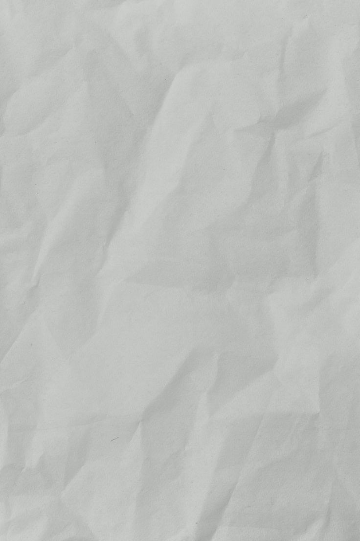 a black and white photo of a piece of paper that has been wrinkled over with some writing on it