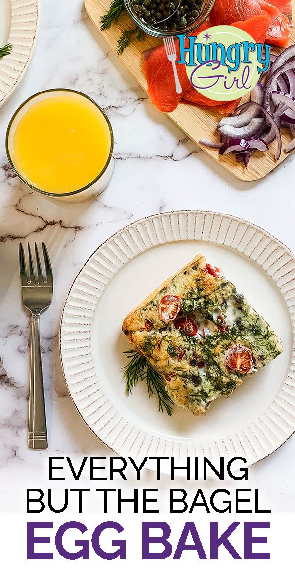 an egg bake on a white plate next to some orange juice and other food