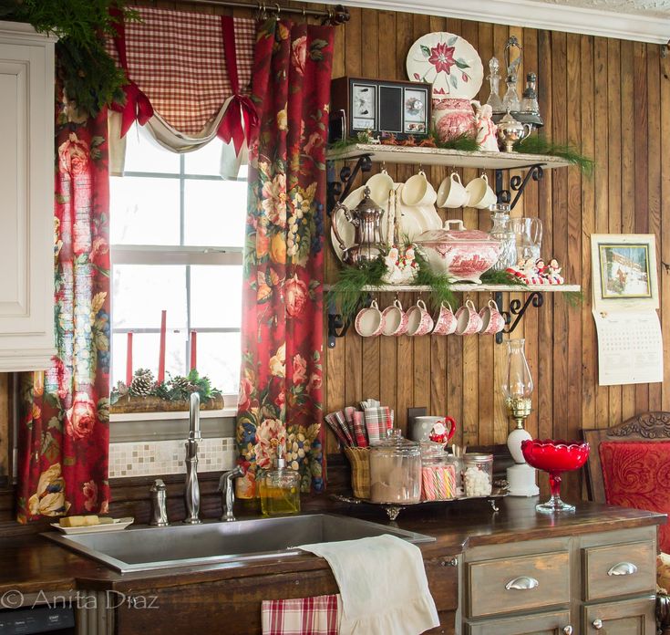 the kitchen is decorated for christmas with red and white decor