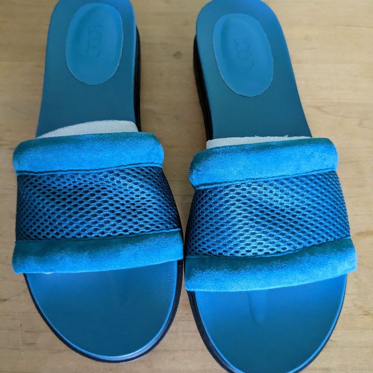 Ladies Logo Dark Aqua Mules. By Lori Goldstein. Original Box. Never Worn. Textile Uppers. Blue Textured Sole Sandals With Open Toe, Blue Open Toe Sandals With Textured Sole, Blue Textured Sole Open Toe Sandals, Blue Leather Sandals With Textured Footbed, Blue Suede Sandals For Summer, Blue Slip-on Round Toe Sandals, Blue Slip-on Open Toe Sandals, Comfortable Blue Leather Sandals, Casual Blue Suede Sandals