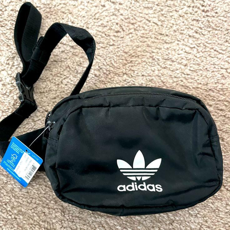 Adidas Fanny Pack New With Tags Across Your Body Or Around Your Waist, Any Way You Style It, This Adidas Waist Pack Is The Perfect Size. Zip Pockets Provide Easy Access To Your Essentials And Keep Your Small Stuff Organized Multiple Zip Pockets Adjustable Waist Strap Adjusts Up To 58 Inches Hidden Zip Pocket Interior Earbud And Charger Storage Color: Black Crossbody Fanny Pack Adidas, Trendy Adidas Black Bag, Trendy Black Adidas Bag, Casual Adidas Shoulder Bag For Travel, Casual Adidas Bags For Everyday Use, Casual Adidas Bag For Everyday, Casual Black Adidas Shoulder Bag, Casual Everyday Adidas Bag, Casual Adidas Black Bag