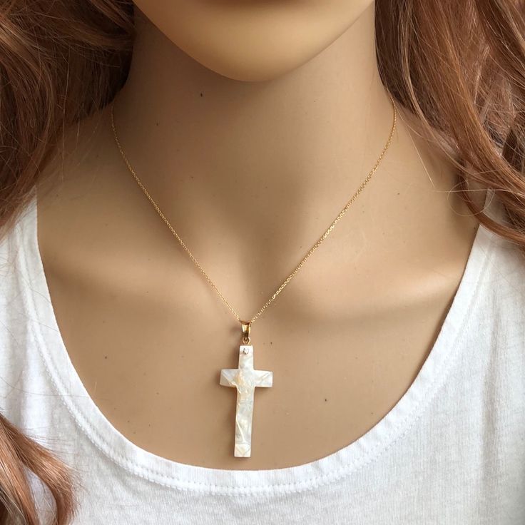 Description: 14k Solid Yellow Gold Shell Pearl Crucific Cross Pendant Dainty Necklace Item No.: P455/2331 Metal Type: 14k Solid Gold Metal Color: Yellow Gold Type Of Stone: Shell Pearl Measurement: Pendant With Bale: 47 X 18 Mm. Shell Pearl: 38 X 19 Mm. Cable Chain Length: 16"-18" Adjustable Approximate Weight: Total Est. Weight: 5.99 Grams (4.26 Grams Pendant, 1.73 Grams Chain) Brand New With Box White Gold Plated Jewelry With Diamond Cut, White Gold-plated Jewelry With Diamond Cut, 14k Gold Cross Jewelry In White, White 14k Gold Clavicle Chain Necklace, White 14k Gold Cross Jewelry, White High Luster Fine Jewelry Necklace, White 14k Gold Diamond-cut Necklaces, White 14k Gold Necklace With Polished Finish, White 14k Gold Diamond Cut Necklaces