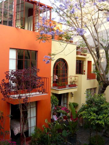 an orange building with many windows and balconies