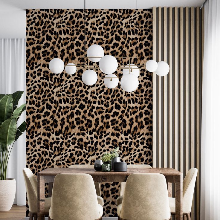 an animal print wallpaper in a dining room with chairs and a wooden table surrounded by white vases