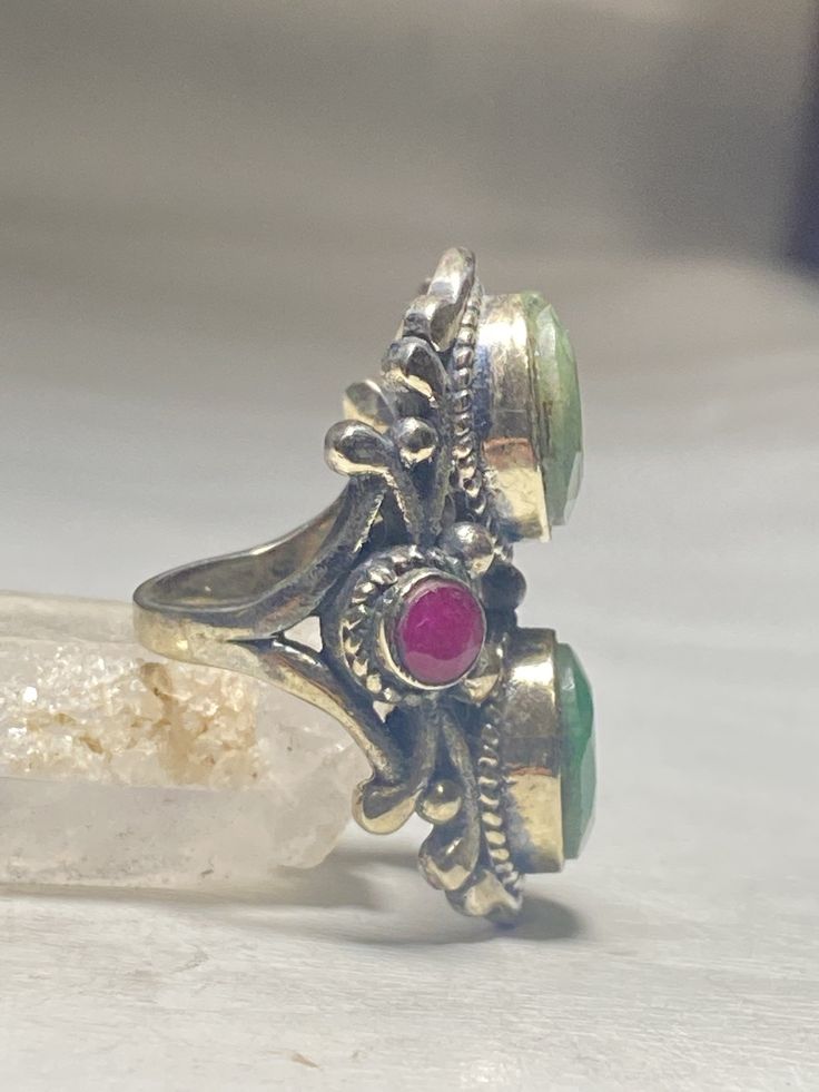 "Emerald Ring Ruby long sterling silver women Low grade stones Size 6.50 Weight 14.8g Length 1 1/2\" Width. 1/2\" Thinnest part of band. 1/8\" Free Shipping & Free Postal Insurance Delivered in a Gift Box If you do not want the ring polished and want to leave the natural patina please let me know at the time of purchase as I do polish rings before I ship rings out. Thanks Free First Class shipping and postal insurance is included. If you want to upgrade to priority kindly pay an additional f Silver Multi-stone Ruby Ring For Anniversary, Vintage Silver Multi-stone Gemstones, Vintage Silver Multi-stone Rings, Vintage Multi-stone Silver Gemstones, Anniversary Emerald Cabochon Ring, Spiritual Sterling Silver Multi-stone Rings, Spiritual Multi-stone Sterling Silver Rings, Silver Emerald Ring With Stones, Silver Emerald Ring With Stones In Fine Jewelry Style