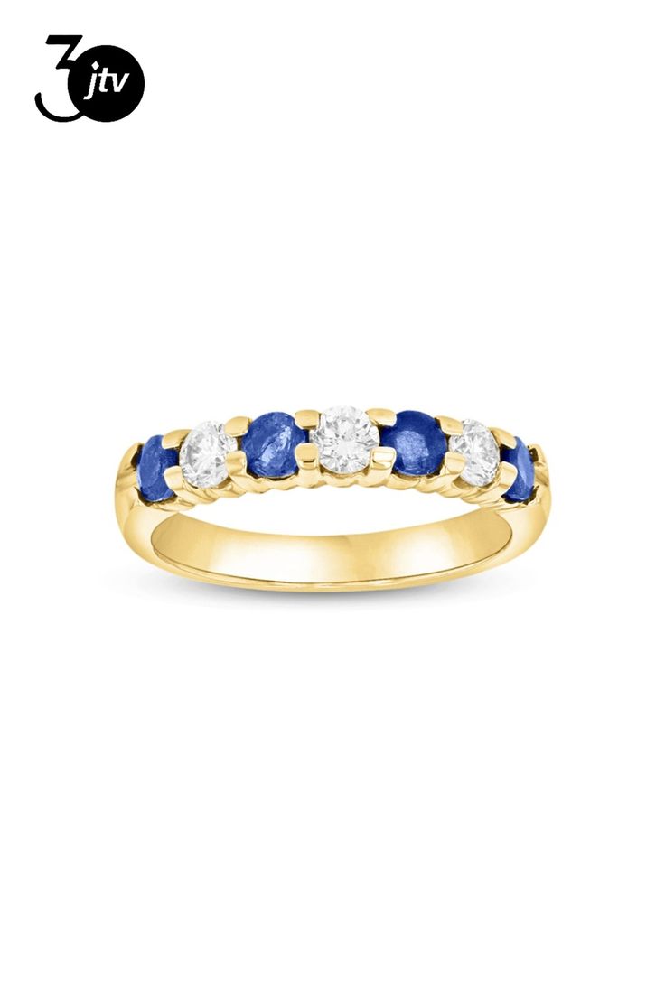 a yellow gold ring with blue and white stones