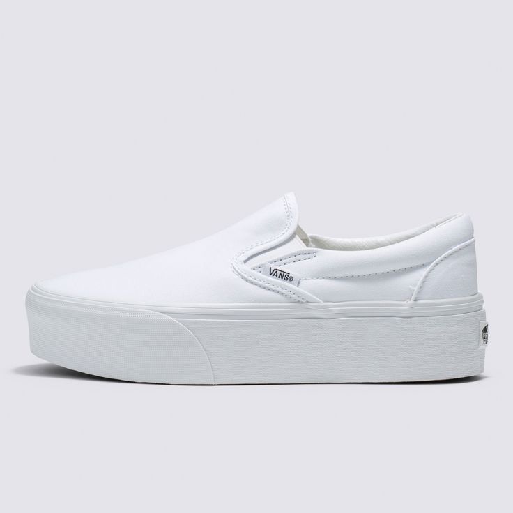 Our Trend-Setting Slip-On Reaches New HeightsThe Classic Slip-On Stackform Canvas refreshes our original slip-on silhouette with an even chunkier take on the platform aesthetic. Constructed with an exaggerated sidewall for double the height, this platform shoe amplifies a classic favorite while bringing a new “Off The Wall” style to your look. Iconic Slip-On shoe 34 mm platform height Sturdy canvas uppers Elastic side accents Supportive padded collars Signature rubber waffle outsoles | Vans Clas Vans Slip-on Sneakers With White Sole, White Textured Sole Slip-ons For Streetwear, White Thick Bottom Canvas Shoes For Spring, Slip-on Sneakers With White Sole And Thick Bottom, White Slip-ons With Rubber Sole For Streetwear, Slip-on Sneakers With Thick Sole, White Slip-on Platform Sneakers With Thick Bottom, White Slip-on Sneakers With Vulcanized Sole For Streetwear, White Vulcanized Sole Slip-ons For Streetwear