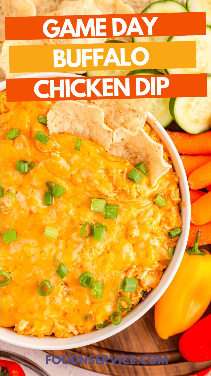 game day buffalo chicken dip in a white bowl with tortilla chips and veggies