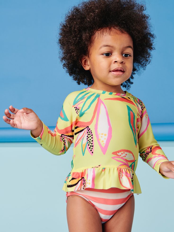 We've mixed and matched prints to create a stylish swim set with fitted bottoms and a long sleeve ruffled rash guard for extra fun in the sun. Featuring UPF 40+ protection. Matching family styles are available in our Sibling Shop. Family Swimwear Matching, Fitted Bottoms, Toddlers Swimwear, Raglan Sleeve Top, Baby Swimming, Swim Sets, 2021 Fashion, Kids Swimwear, Swim Wear