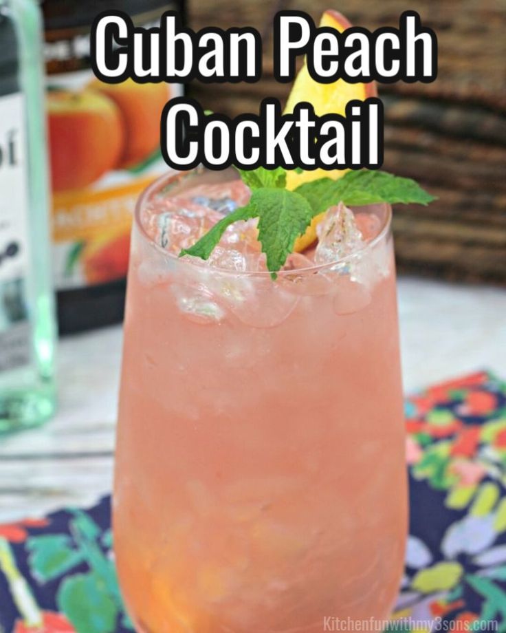 a close up of a drink in a glass with the words cuban peach cocktail on it