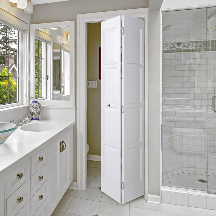 a bathroom with two sinks and a large mirror on the wall next to each other