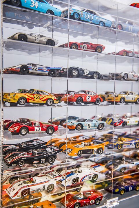 a display case filled with lots of toy cars