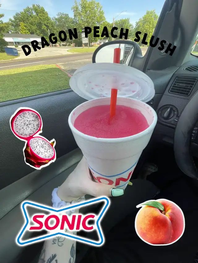 there is a drink in the cup on the back seat of a car with dragon peach slush