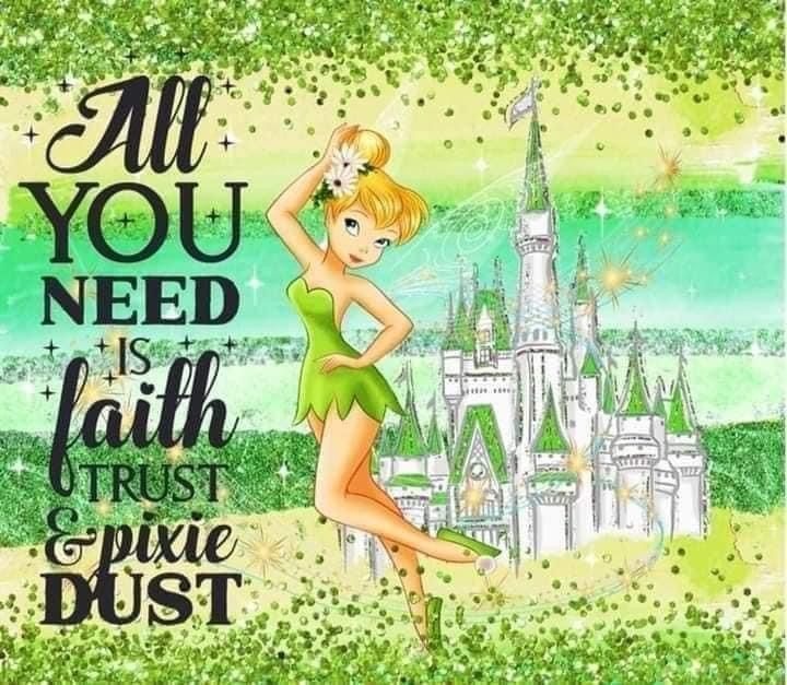 the tinkerbell fairy is standing in front of a castle with her hand on her head