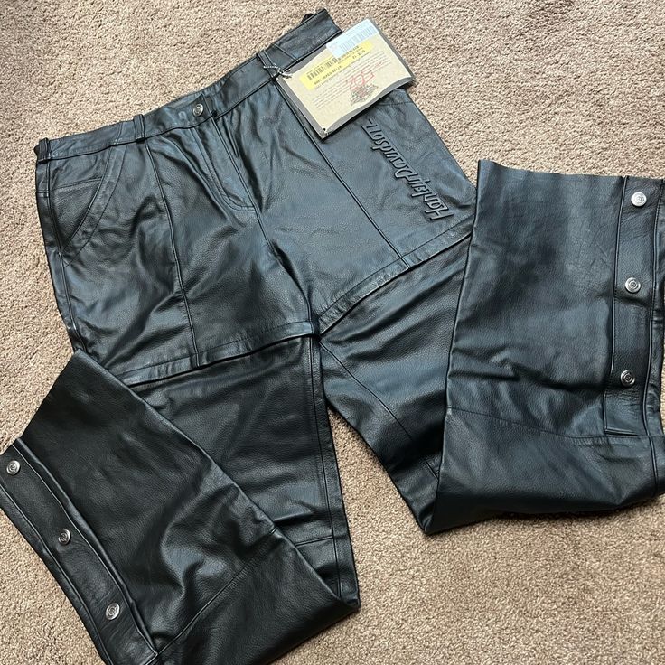 Black Leather Harley Riding Pants Size 12, Zip Off Into Shorts, Nwt. Inseam Is 33.5” And Waist Is 16.75” Or 33.5” Biker Pants With Belt Loops And Straight Leg, Biker Pants With Belt Loops And Standard Cut Leg, Biker Bottoms Straight Leg For Motorcycling, Biker Straight Leg Bottoms For Motorcycling, Biker Style Straight Leg Bottoms For Motorcycling, Biker Pants With Pockets For Motorcycling, Biker Style Straight Leg Bottoms With Pockets, Fitted Motorcycle Pants With Pockets, Biker Pants With Belt Loops For Motorcycling