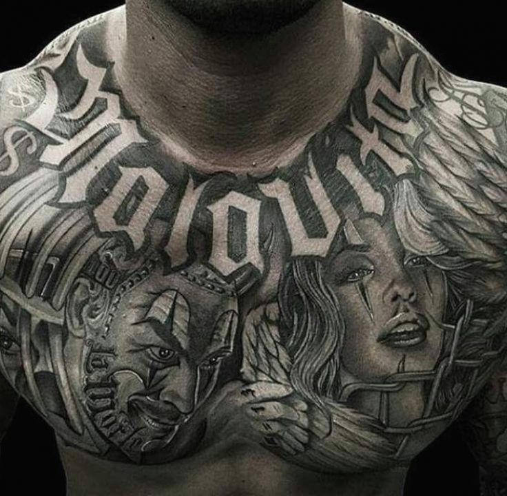 a man with tattoos on his chest is posing for the camera