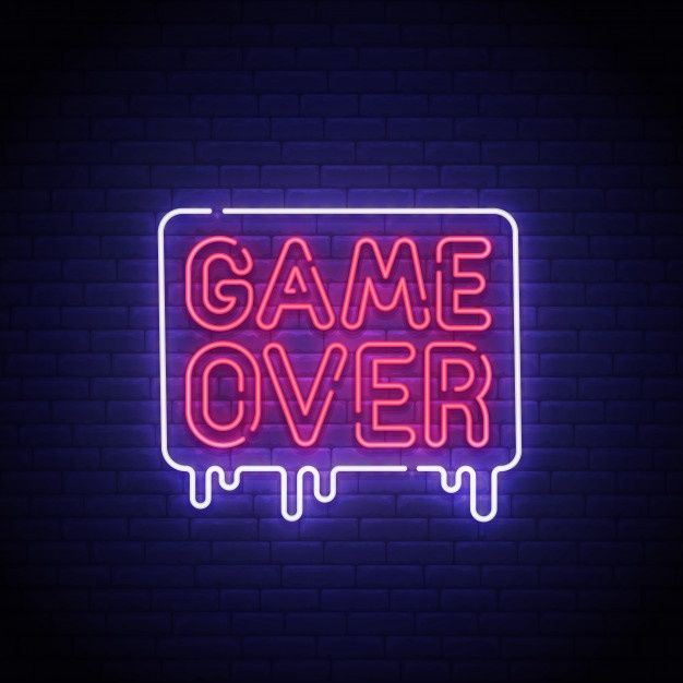 game over neon sign on brick wall