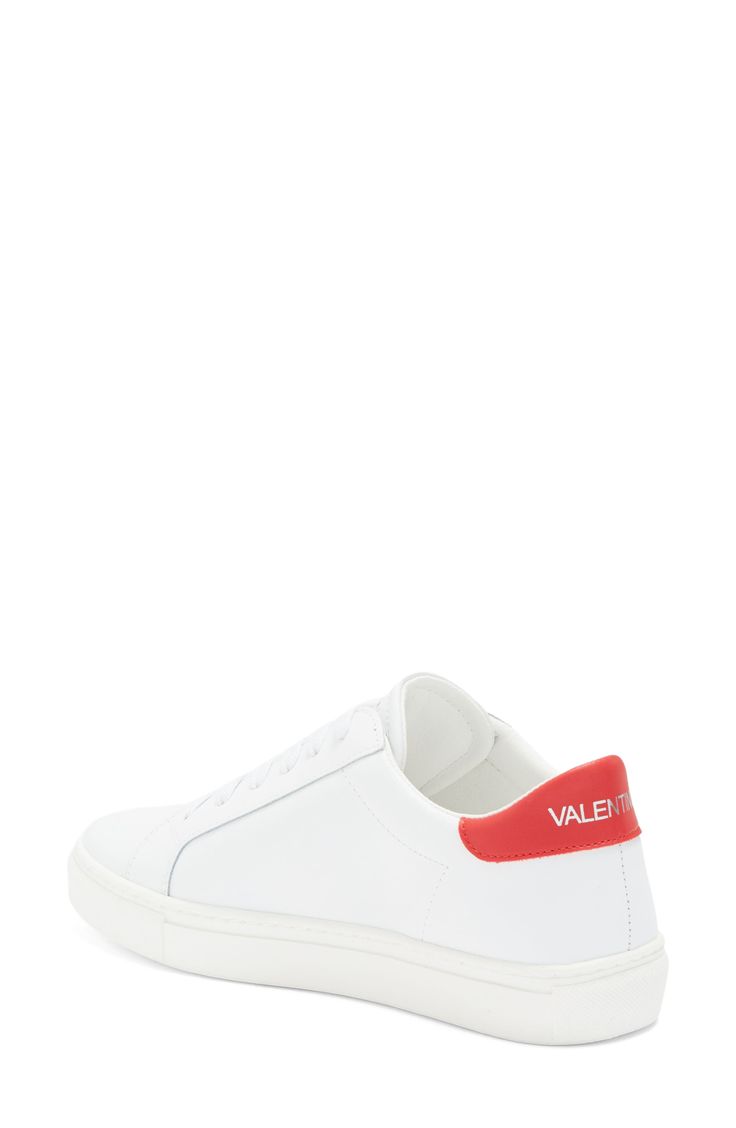 The brand's logo and a contrasting collar define a low-top sneaker shaped from smooth leather and secured with a classic lace-up closure. Leather upper/textile lining/synthetic sole Imported Low-top Logo Embellished Sneakers For Streetwear, Sporty Red Sneakers With Logo Print, Designer Low-top Sneakers With Red Sole, Red Leather Sneakers With Logo, Red Low-top Sneakers With Embossed Logo, Red Textured Low-top Sneakers, Pink Valentino Sneakers, Valentino White Sneakers, Mario Valentino