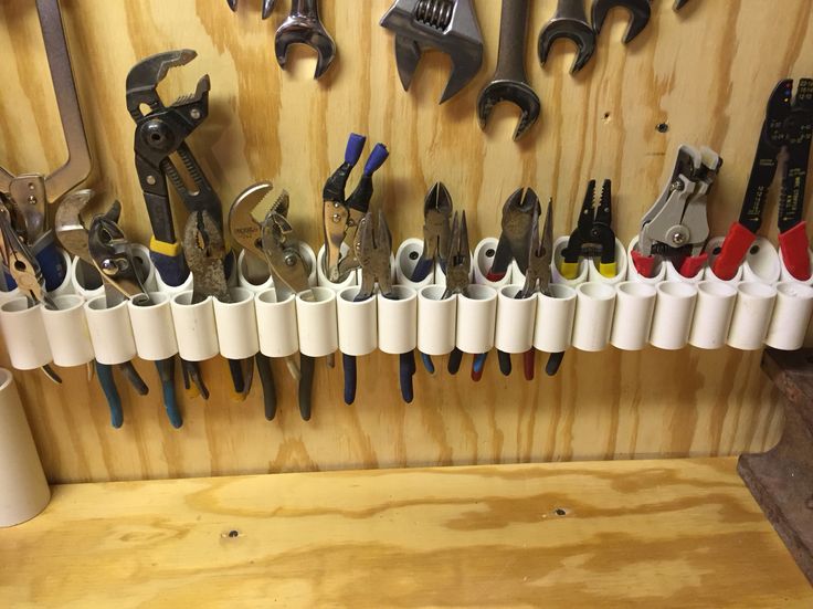 there are many tools hanging on the wall