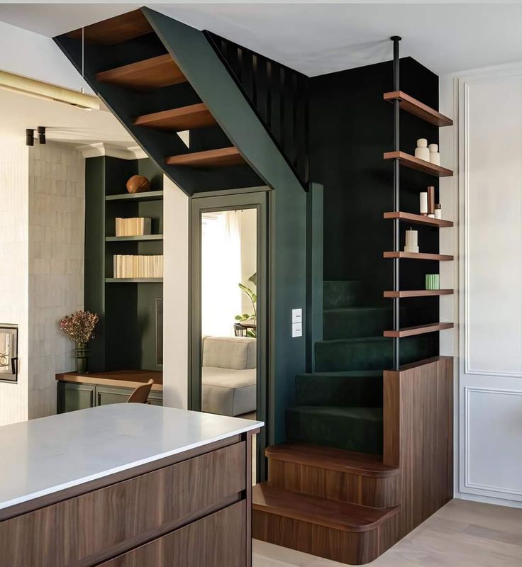 the stairs in this modern home are made of wood and metal, with shelving on each side