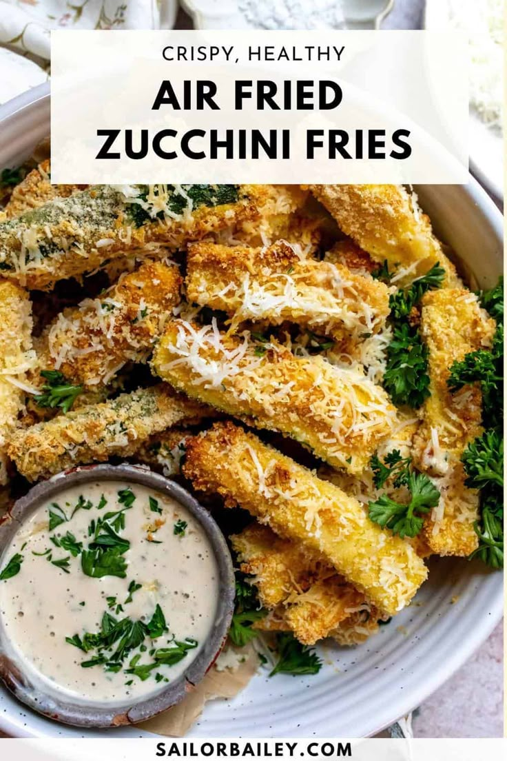 crispy fried zucchini fries in a bowl with dipping sauce on the side