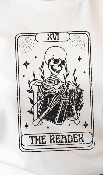 a white t - shirt with an image of a skeleton playing the drums