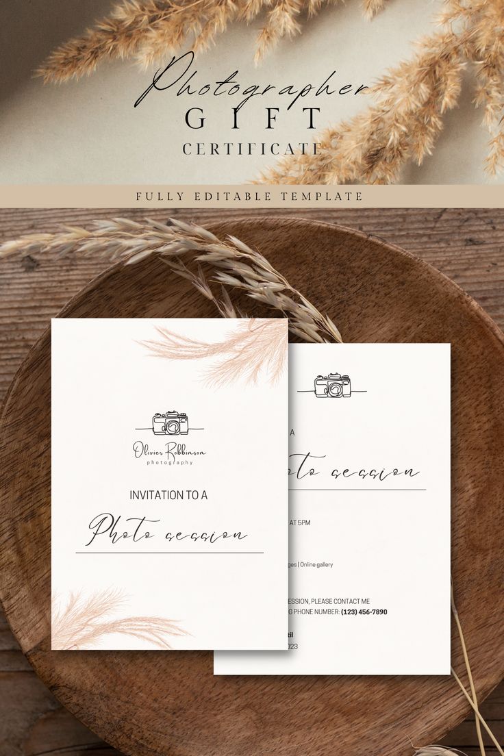 the wedding stationery is displayed on top of a wooden plate with wheat stalks in front of it