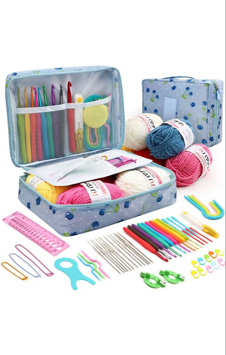 an open suitcase filled with knitting supplies