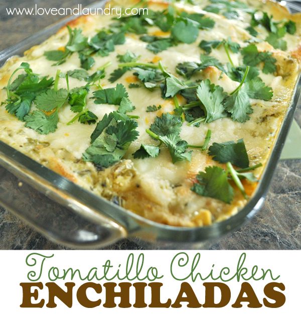 an enchilada casserole in a glass dish with cilantro on top