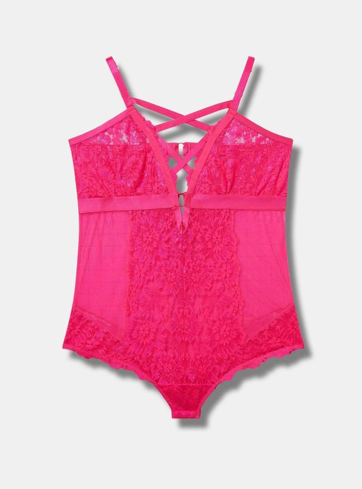 FIT Wireless cups. Bodysuit silhouette. Adjustable straps. . MATERIALS + CARE Lace knit fabric. . 87% nylon, 13% elastane. Machine wash cold. Line dry. Imported. DETAILS Floral lace throughout. . Strappy detail. The best plus size women's floral lace strappy bodysuit bodysuits in pink glo made of lace. Torrid is your destination for the freshest spring and summer styles. Fitted Strappy Bodysuit With Built-in Bra, Fitted Lace Bodysuit With Spaghetti Straps, Summer Straps With Built-in Bra And Fitted Style, Sleeveless Polyamide Bodysuit For Spring, Summer Bodysuit With Crisscross Spaghetti Straps, Lace Bodysuit With Spaghetti Straps For Summer, Summer Lace Bodysuit With Spaghetti Straps, Summer V-neck Lace Bodysuit, Spring Party Bodysuit With Straps