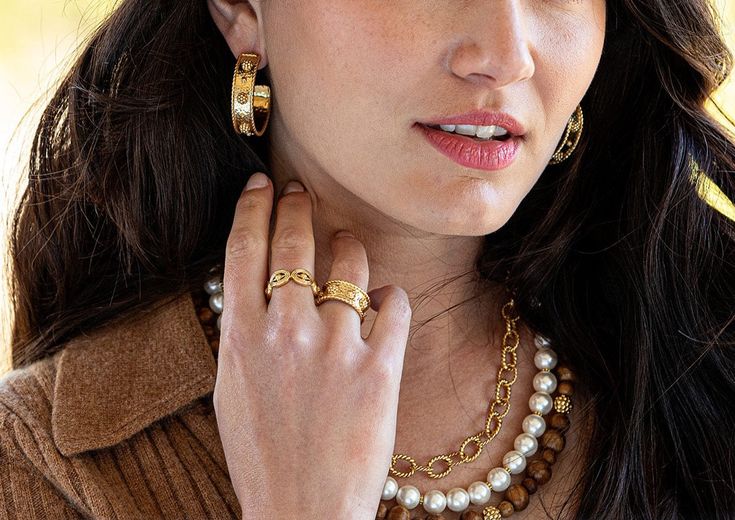 Half-Parisian, half-Texan, Capucine De Wulf’s unique upbringing was the inspiration for her namesake jewelry line. Her accessories combine French romance with an American sensibility, as in the Berry Hoop Earrings in Hammered Gold. These clean and classic statement hoops, wrought in hammered gold, are finished with the brand’s elegant berry and thread motif. Product Details 18K gold-plated brass. Made by hand with natural materials—slight imperfections mean that no two are exactly alike. Care In French Romance, Hammered Gold, Natural Materials, Berry, 18k Gold, Hoop Earrings, Thread, Im Not Perfect, Romance