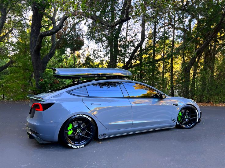 a car parked in front of some trees