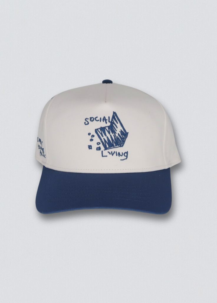 Elevate your style game with our Social Living Snapback Hat. Crafted from classic canvas, this 5-panel baseball cap captures is embroidered with intricate detailing at the front and side. It exudes sophistication and style. Complete with an adjustable snapback closure for a customized fit, it's the perfect accessory for those who crave both speed and flair. Available in solid white with a blue brim and embroidery or solid white with a forest green brim and embroidery, choose the color that best Embroidered Logo 5-panel Baseball Cap For Baseball Season, Blue Cotton 5-panel Baseball Cap, 5-panel Snapback Hat With Embroidered Logo For Streetwear, Embroidered Logo 5-panel Snapback Hat For Streetwear, Summer 5-panel Snapback Hat With Embroidered Logo, Summer Embroidered Logo 5-panel Snapback Hat, Blue Cotton 5-panel Snapback Hat, Blue Cotton Snapback Trucker Hat, Spring Streetwear Baseball Cap With Flat Brim