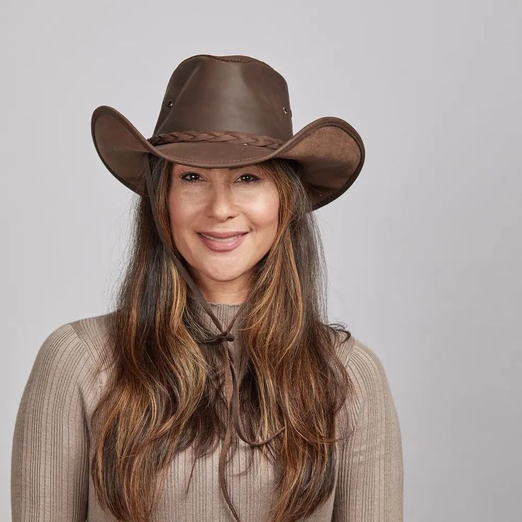 Hollywood | Womens Leather Cowgirl Hat offers a bold Western look with its cowhide leather construction and braided leather band. The adjustable chin cord ensures a secure fit for any adventure. Material: Midweight USA Cowhide Leather Shape: Cowboy Trim: Braided Leather Band Brim Size: 3 3/4" Crown Height: 4 1/2" Feature: Adjustable Chin Cord; Three Eyelets on Side for Ventilation Sweatband: AHM Velcro Imported Curly Hair Cowgirl Hat, Brown Country Style Rodeo Hat, Cowgirl Hats Tan, Cowgirl Hat Brown, Brown Leather Western Hat, Straw Cowgirl Hat, White Cowboy Hat, Hats For Big Heads, Brown Cowboy Hat