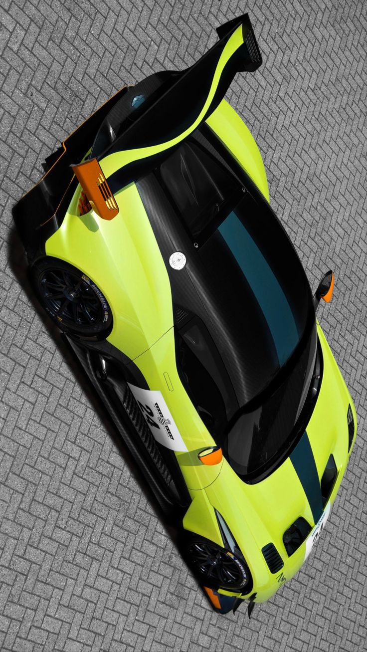 an overhead view of a yellow sports car