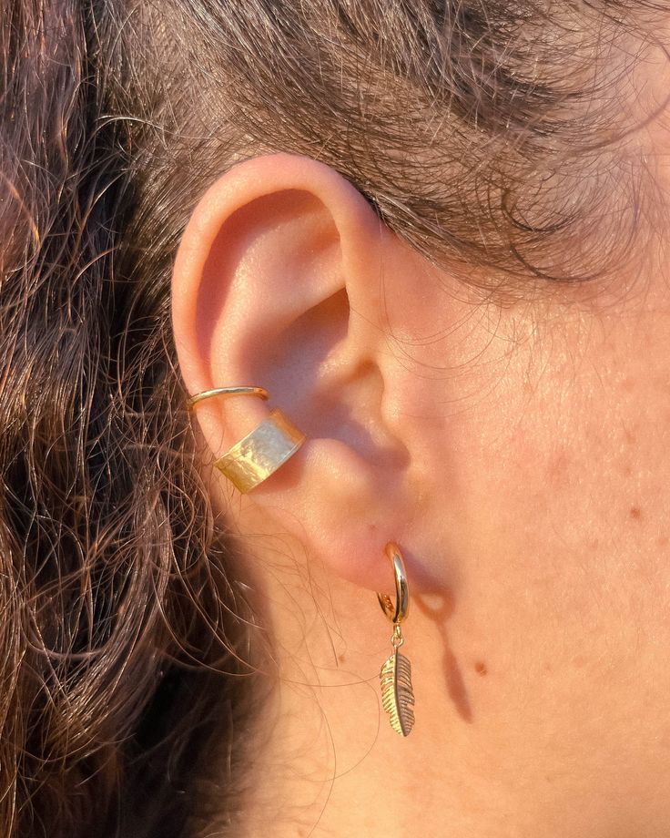 Our "Boho Ear Cuff" is a captivating and eye-catching piece that effortlessly stands out! This bold and shiny ear cuff is perfect for those who want to make a statement without the need for a piercing. Crafted with utmost precision, this extraordinary cuff features a 14k gold filled finish, exuding luxury and elegance. Wear it with confidence on your cartilage for a unique and stylish look. Elevate your jewelry collection with this exquisite ear cuff that adds a touch of glamour to any ensemble. This ear cuff is a perfect gift choise for your loved ones, him or her, or yourself! ✽ %100 Handmade ✽ 925k Silver material with 14k Gold Filled or Rhodium plated (silver color) surface. ✽ Does not require any piercings ✽ The product is non-oxidizing and nickel-free. Thick gold filled or rhodium pl Handmade Adjustable Gold Ear Cuff, Adjustable Ear Wire Cartilage Earrings For Festivals, Adjustable Cartilage Earrings With Ear Wire For Festivals, Adjustable Pierced Ear Climbers As Gift, Adjustable Ear Climbers As A Gift, Hypoallergenic Dangle Cartilage Earrings, Adjustable Bohemian Ear Climbers As A Gift, Bohemian Adjustable Ear Climbers For Gift, Bohemian Style Ear Cuff For Festivals