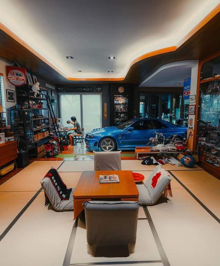 a car showroom filled with cars and furniture