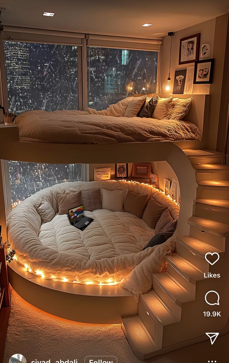 two beds with lights on them are in the middle of a room next to a window