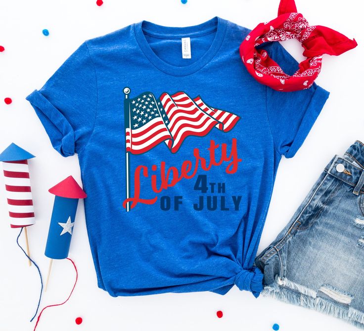 Celebrate our favorite American patriotic holiday with the Liberty 4th of July T-shirt! Featuring a traditional red, white, and blue design, this graphic tee is the perfect wardrobe piece for picnics, barbecues, fireworks, beach days, lake afternoons, amusement parks, patriotic events, and road trips! Pair with shorts or jeans, or layer with a kimono, cardigan, or jacket for an elevated style. Available in sizes S -3X in a variety of colors. Note: This product is an Embark Select item. Embark gi American Flag T-shirt For 4th Of July, Summer Americana Style Short Sleeve T-shirt, Red Americana T-shirt With American Flag, Memorial Day Blue T-shirt With American Flag Print, Americana T-shirt With American Flag For 4th Of July, Blue Graphic Tee For Independence Day, Blue Short Sleeve T-shirt For Independence Day, Patriotic Blue T-shirt For Summer, Patriotic Screen Print T-shirt For Summer