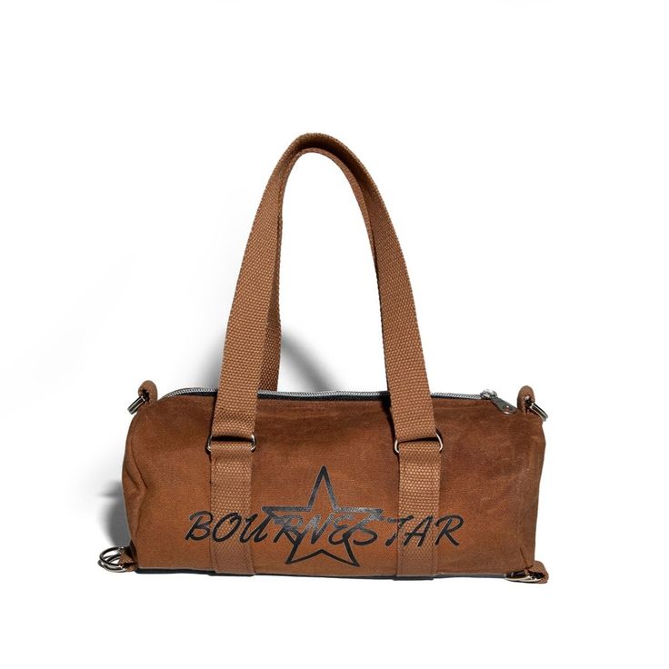 Stand out from the crowd with our Bournestar™ Duffle Bag. Made from 2 layers of heavyweight denim, making it soft to the touch and durable. With a spacious interior and 2 side pockets this bag fits all the essentials - perfect for day to day life. Wear with a pair of our sweats or any outfit of your choice. Functional Brown Travel Bag For Everyday, Functional Brown Everyday Travel Bag, Trendy Everyday Duffle Bag With Pockets, Brown Shoulder Duffle Bag For Everyday Use, Brown Duffle Bag With Removable Pouch For Everyday, Casual Brown Canvas Duffle Bag, Brown Duffle Bag With Pockets For Daily Use, Brown Duffle Bag With Pockets, Brown Practical Duffle Bag For Daily Use