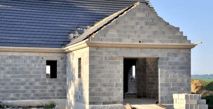 a house being built on the side of a hill