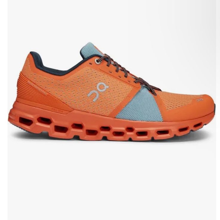 a pair of orange and blue running shoes on a white background with the word on it