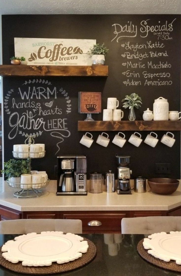 a coffee shop with chalkboard menus on the wall and place settings for plates