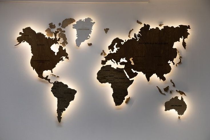 the world map is made out of wood and has lights on it's sides